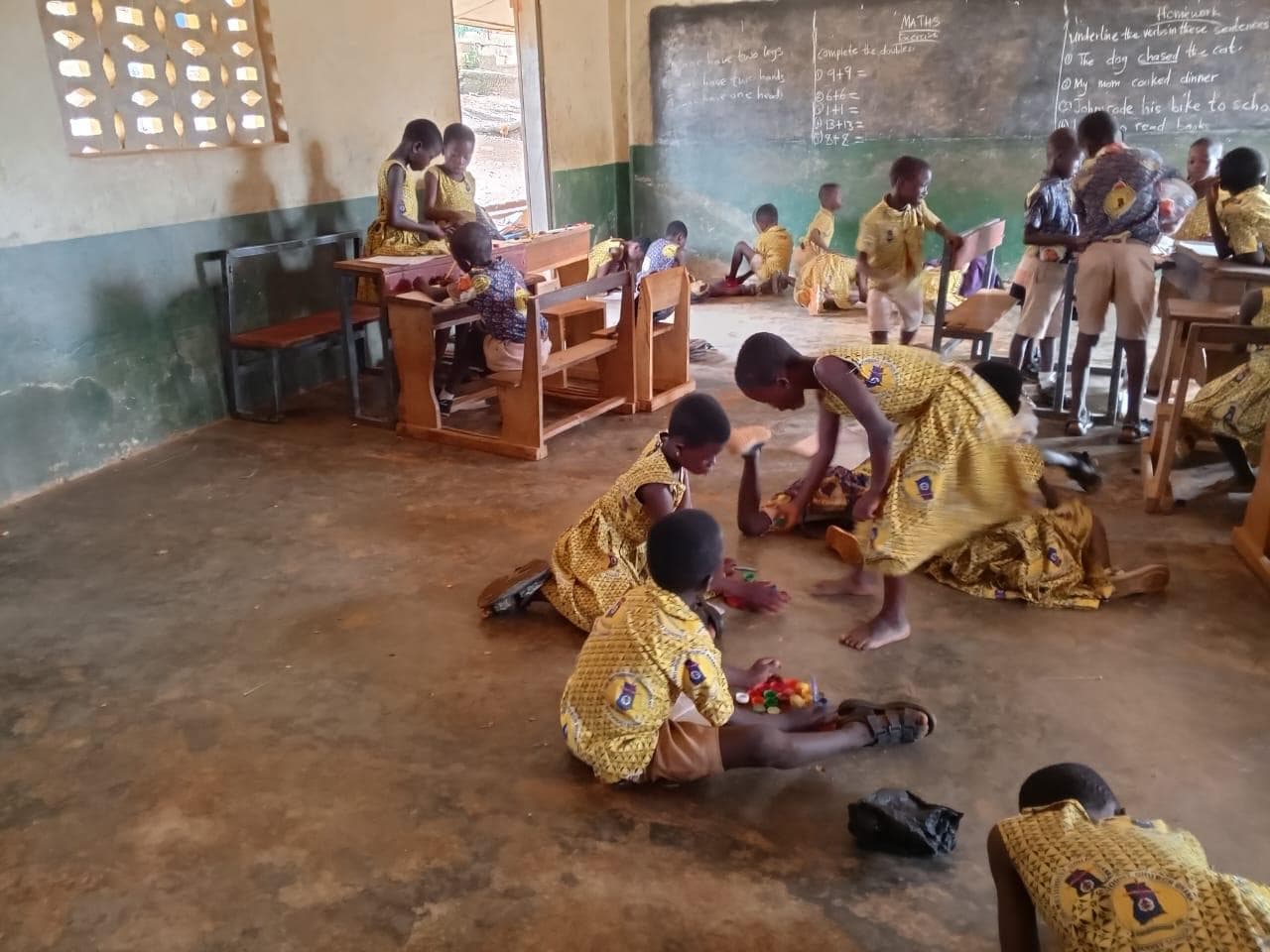 Beppoh classroom before renovation — bare concrete floor, broken benches