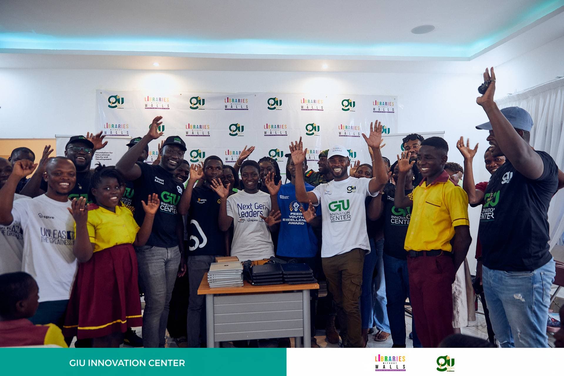 GIU Innovation Center — students with donated laptops in Ghana