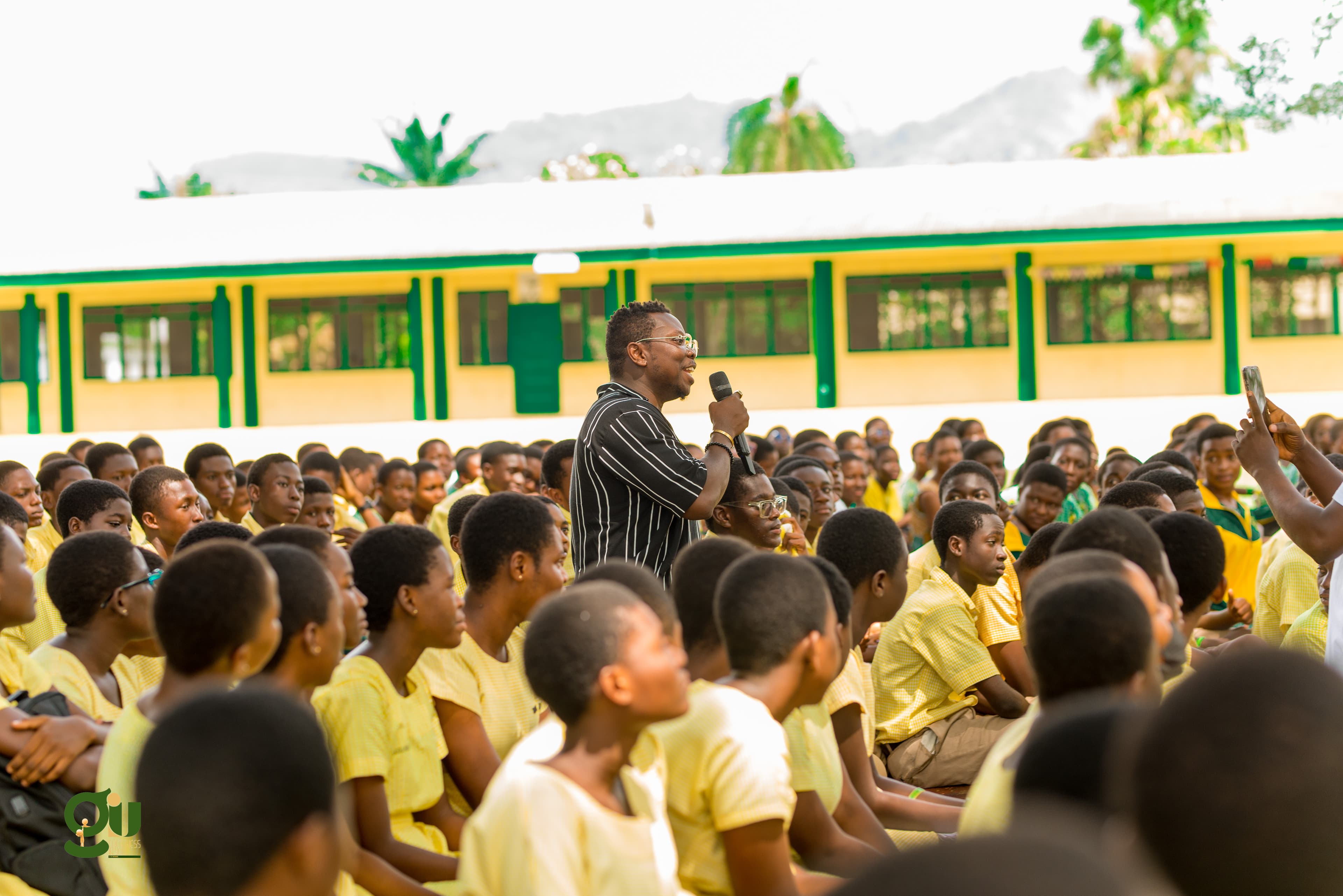 Founder Kesse Anyimadu speaking among thousands of students at Ghana Secondary Senior High School (Ghanass)
