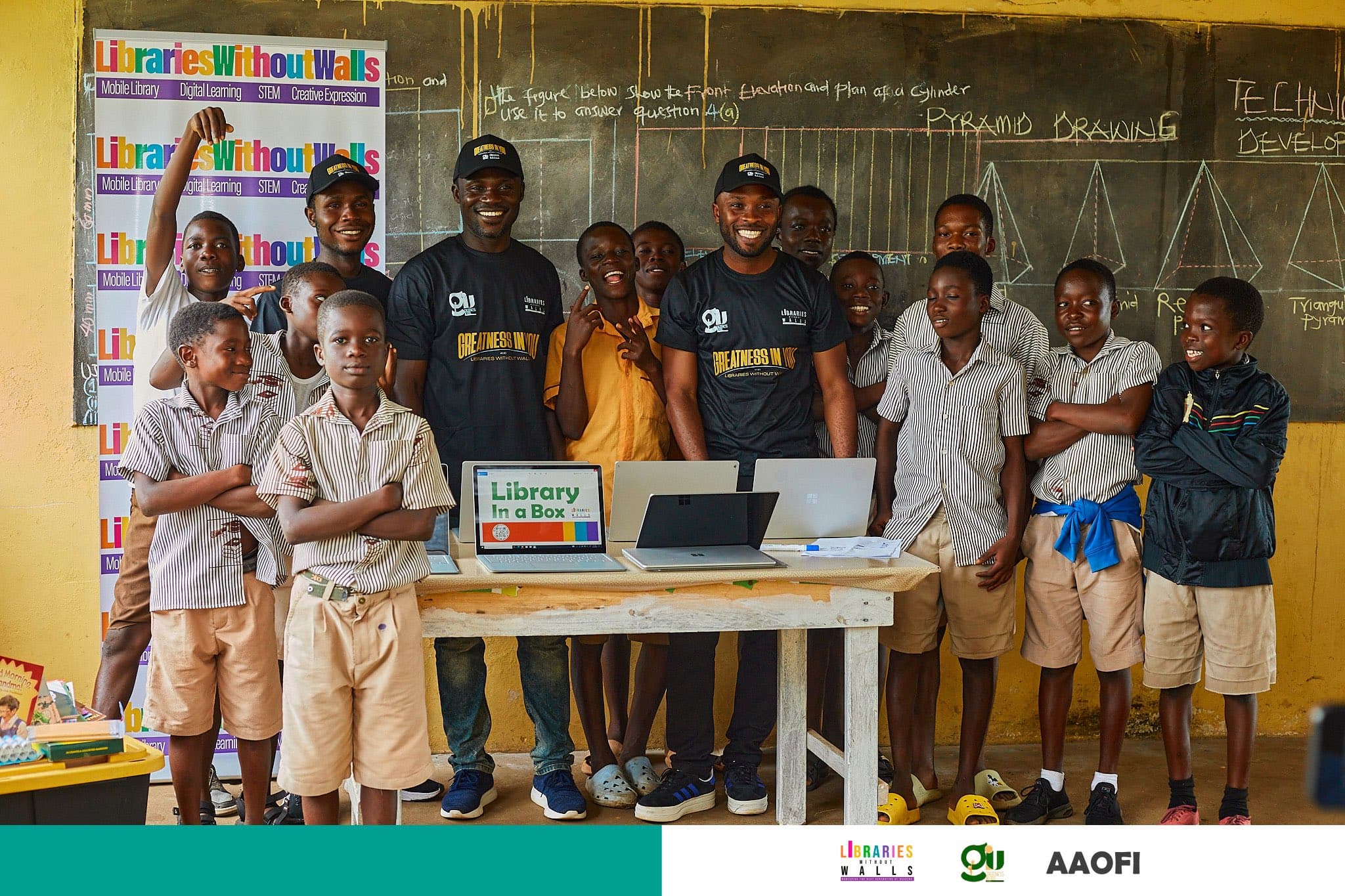 GIU Innovation Center — students with donated laptops in Ghana