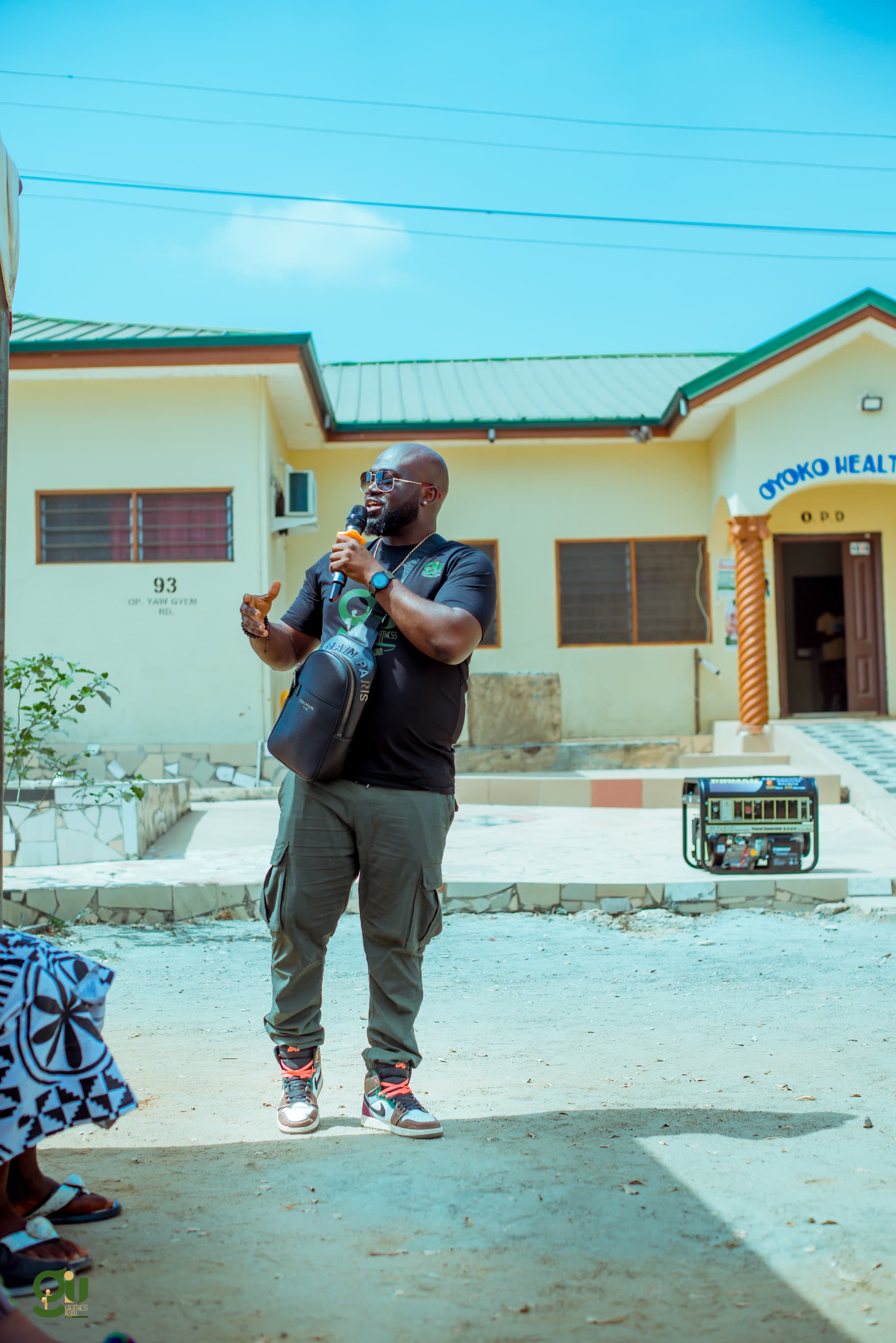 Full GIU team standing in front of Oyoko Health Centre after donating a 7.5 KVA generator