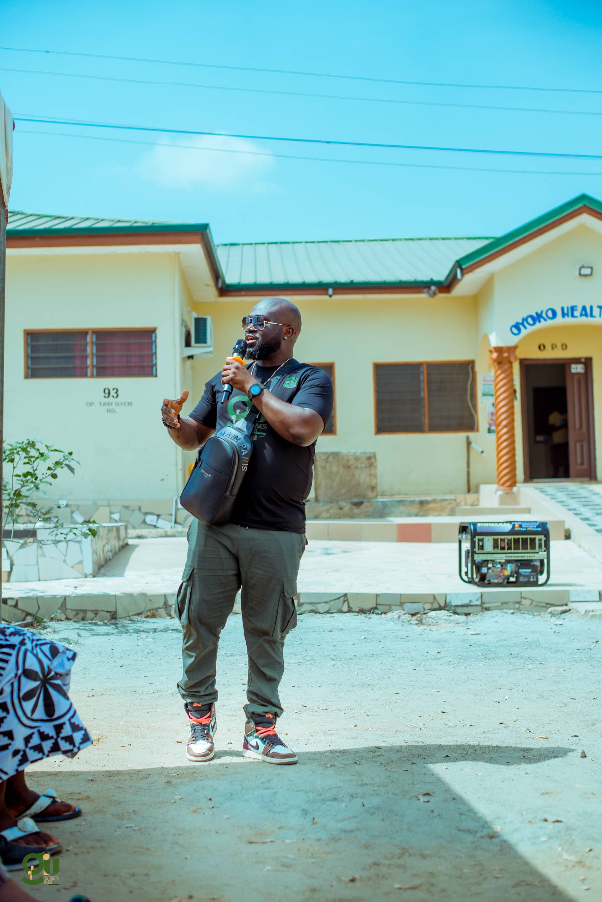 Board Member Nana Obiri Boateng addressing the community during the 7.5 KVA generator presentation at Oyoko Health Centre