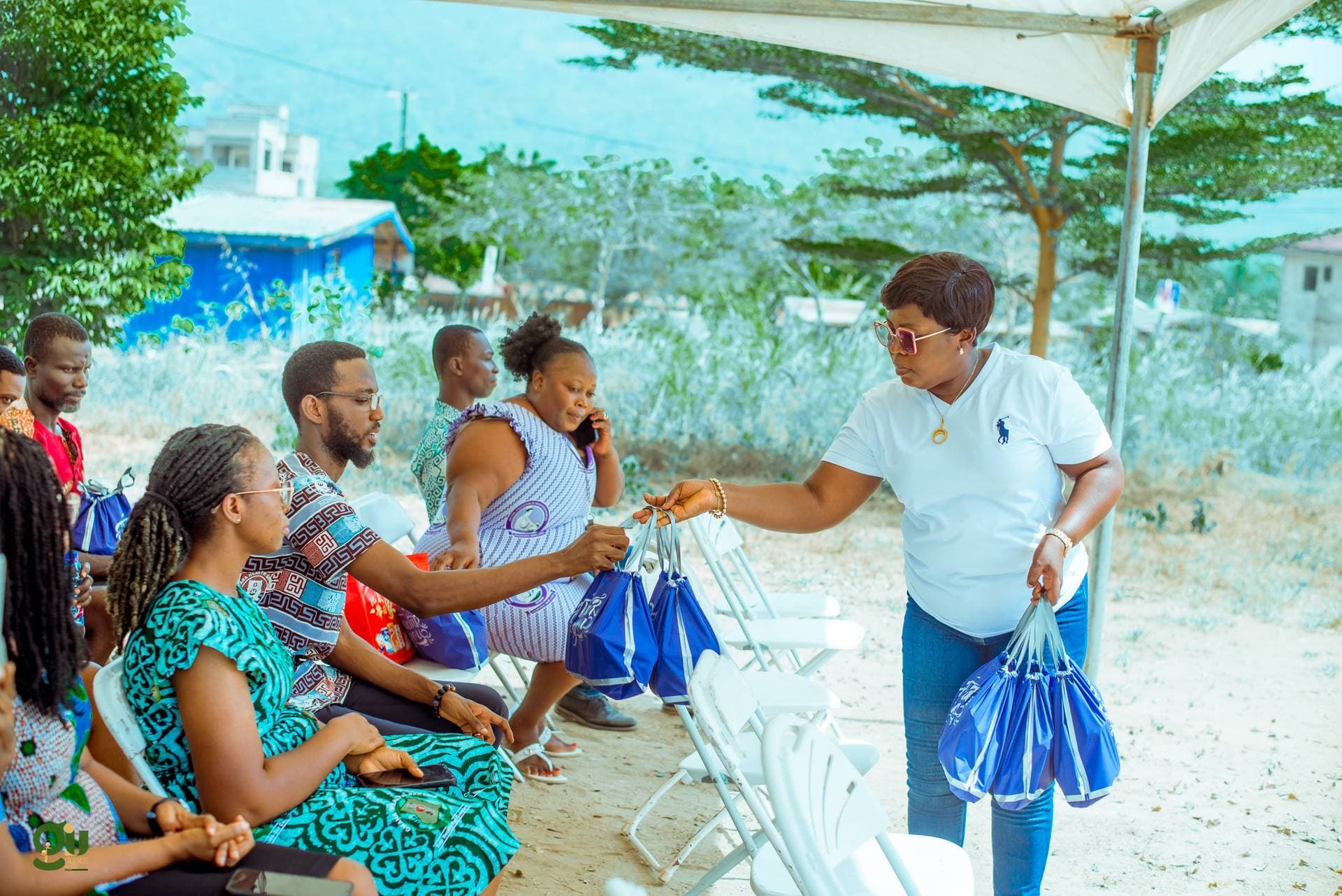 GIU team distributing gift bags to community members at Oyoko event