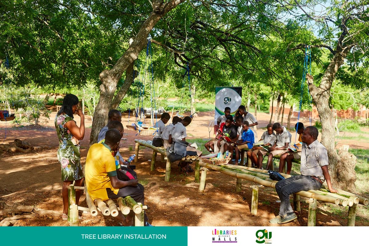 Students reading at the GIU Tree Library in Ayikuma, Ghana